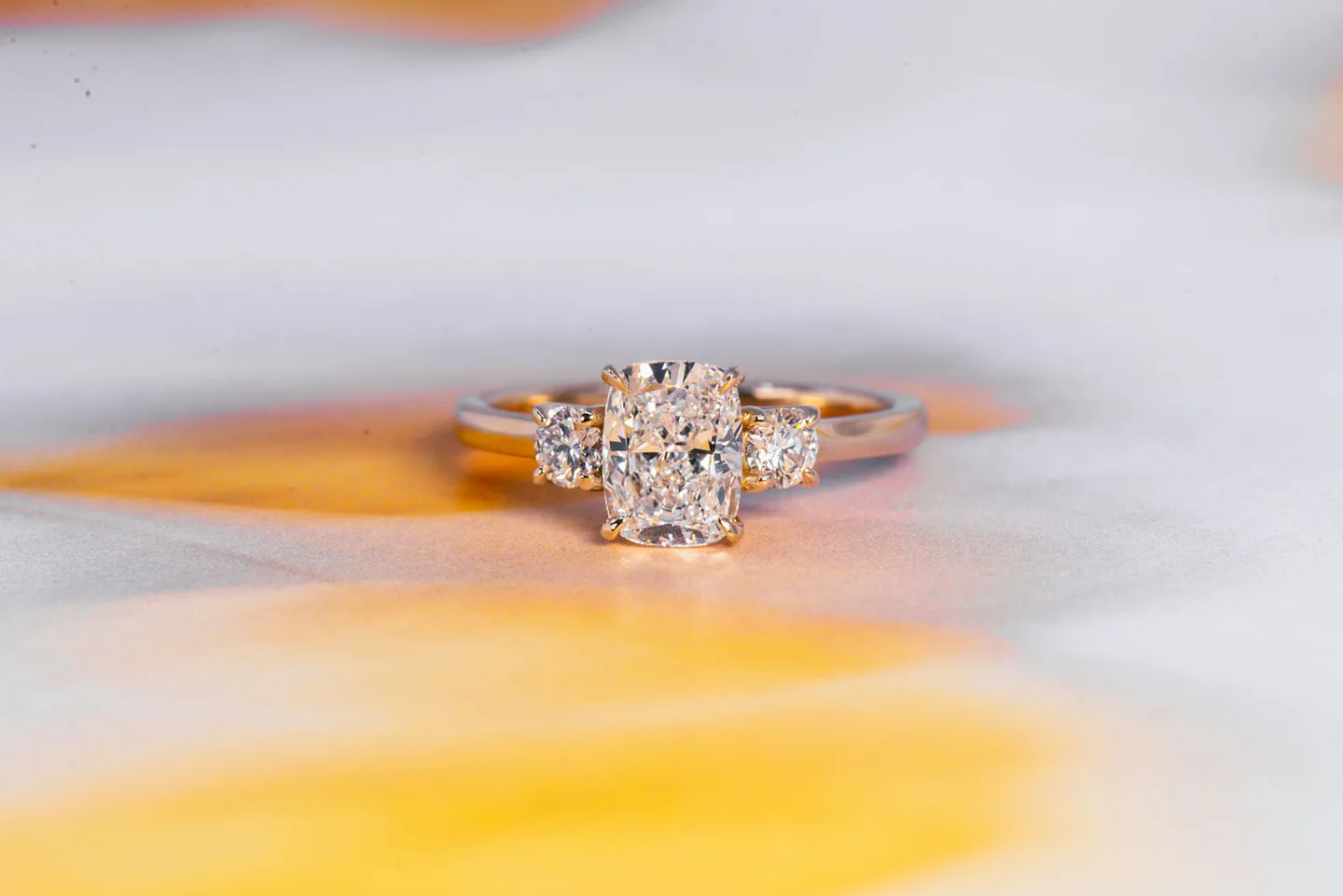 Elongated Cushion + Round Three-Stone Engagement Ring (lab diamond, white gold band)
