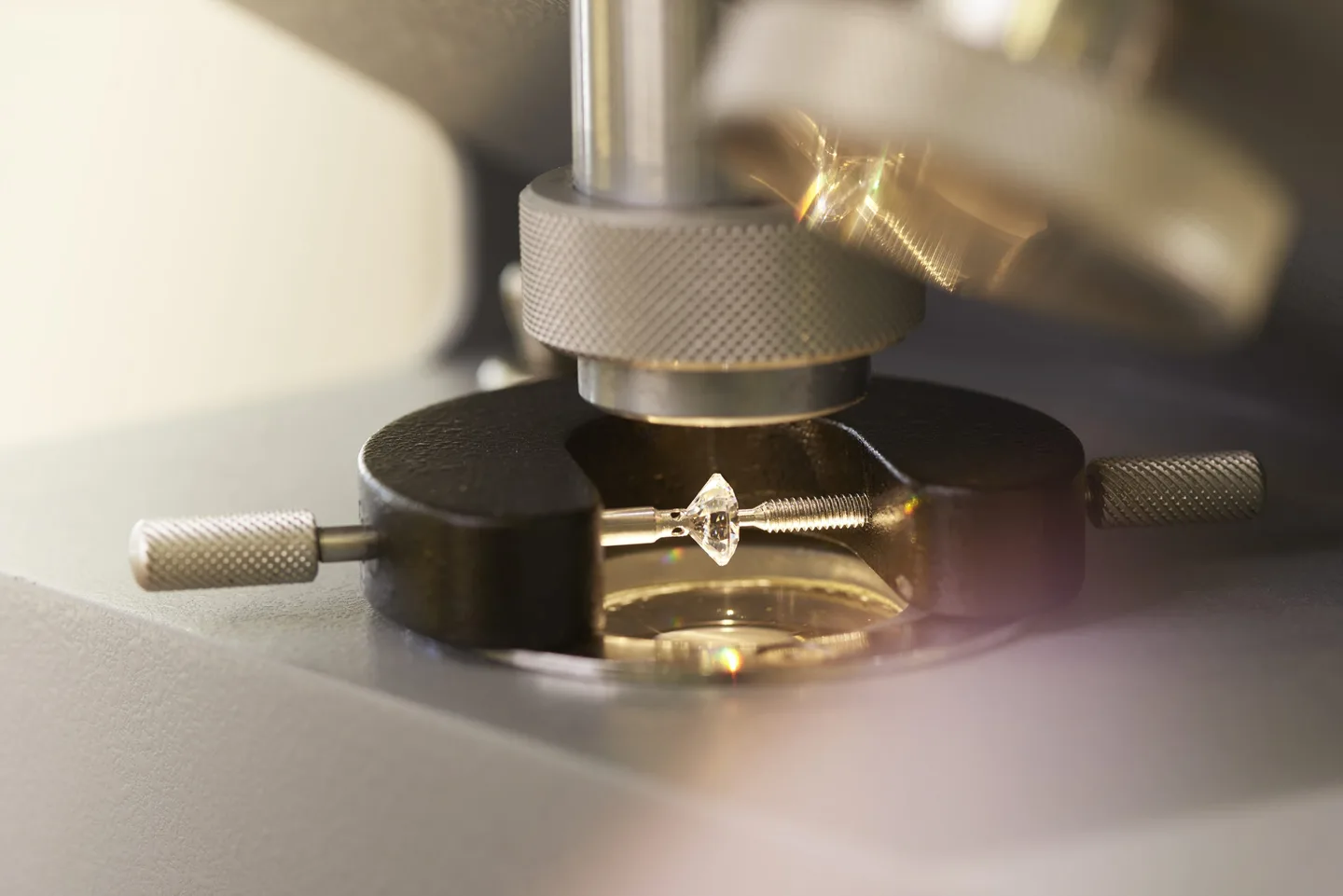A diamond set under a gem microscope for inspection