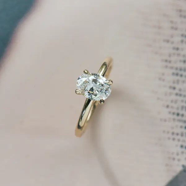 Oval Solitaire Engagement Ring With Hidden Halo And Petite Prongs