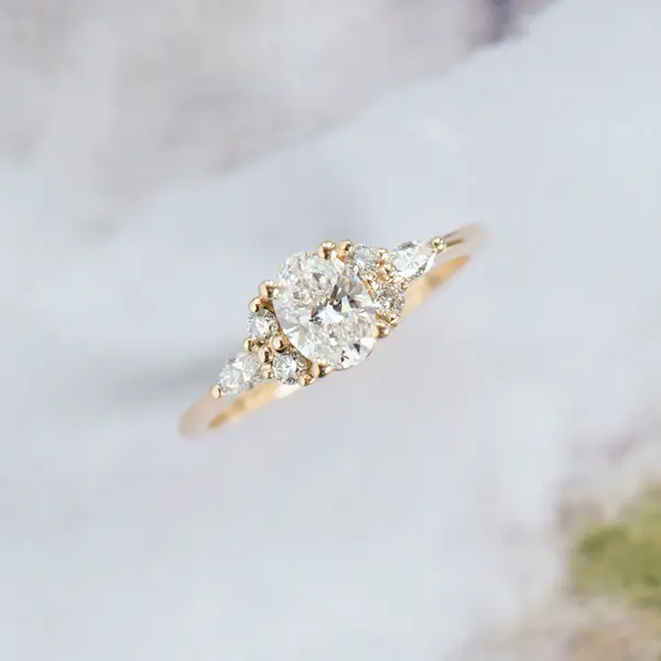 Oval Engagement Ring With Round And Marquise Side Stones