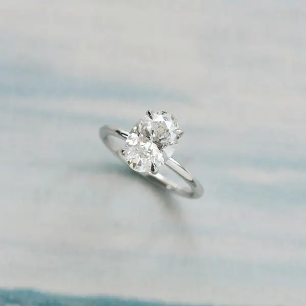 Classic Oval Solitaire Engagement Ring With Hidden Halo