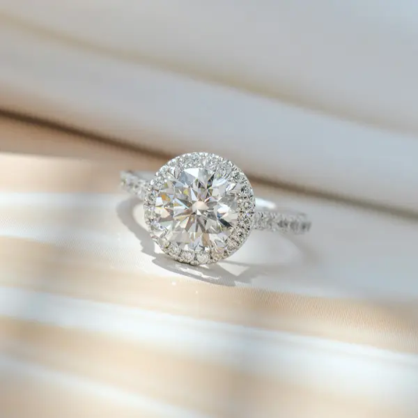 Elevated Focal Round Stone Engagement Ring With Pavé