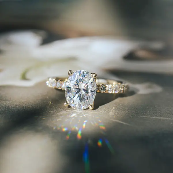 Oval Engagement Ring With Pavé Band and Petal Prong Setting