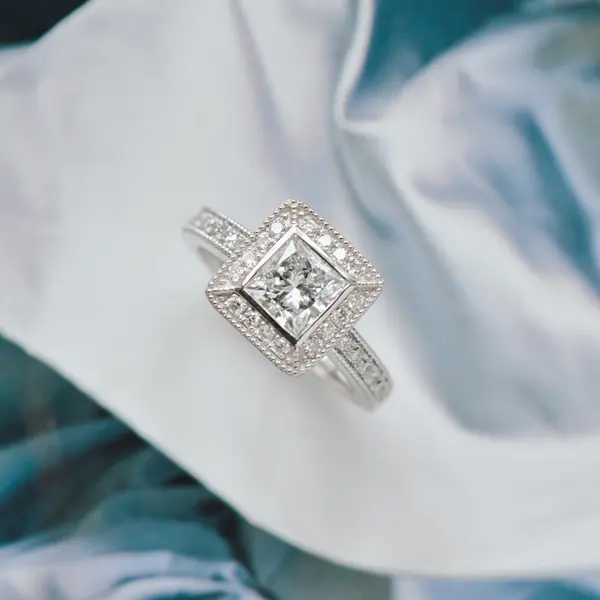 Art Deco Princess Engagement Ring With Halo, Pavé, and Milgrain Detail