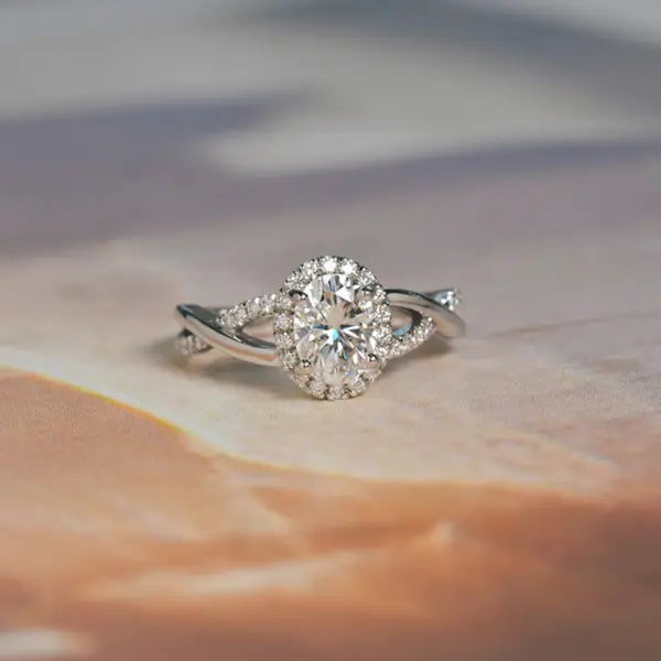 Halo Oval Engagement Ring With Pavé and Split-Shank Band