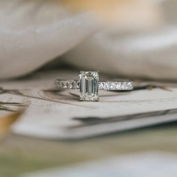 Classic Emerald Engagement Ring With Pavé Band
