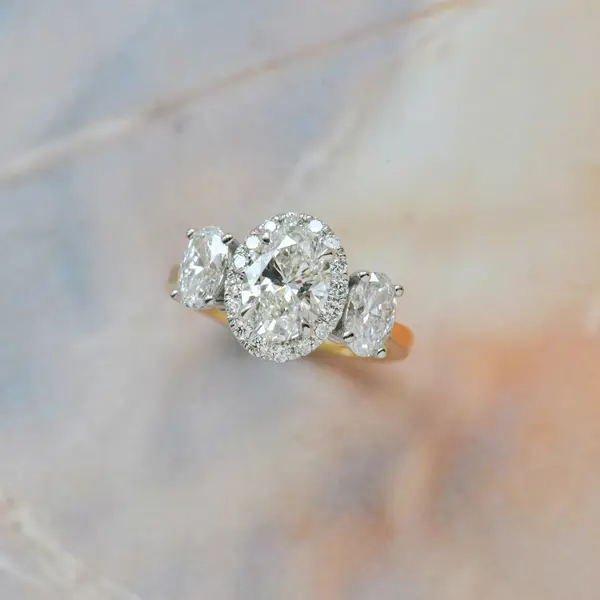 Two-Tone 3-Stone Oval Halo Engagement Ring