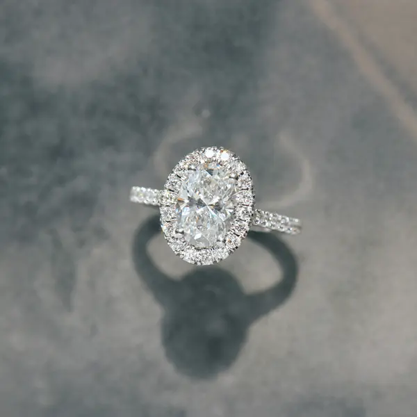 Oval Engagement Ring With Pavé Halo and Cathedral