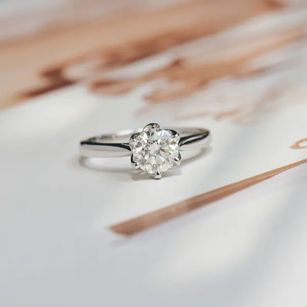 Petal Prong Round Solitaire Engagement Ring With Tapered Band