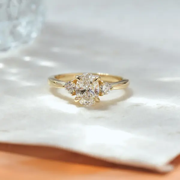 3 Stone Oval And Round Engagement Ring With Tapered Band