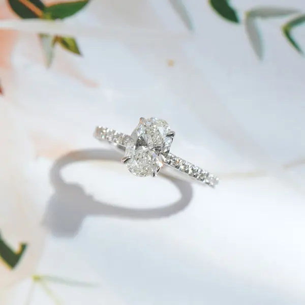 Oval Pavé Solitaire Engagement Ring With Cathedral And Whale Tail