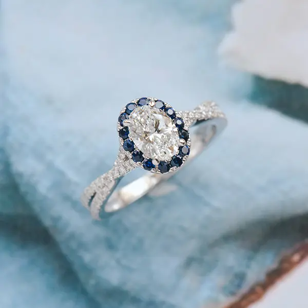 Oval Engagement Ring With Sapphire Halo