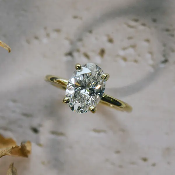 Oval Solitaire Engagement Ring With Round Prongs
