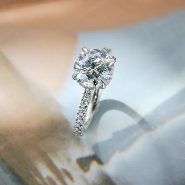Round Hidden Halo Engagement Ring With Pavé Band