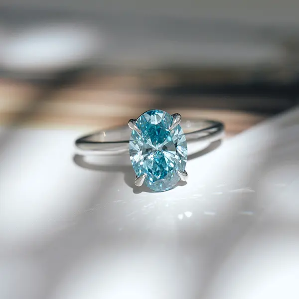 Blue Diamond Oval Solitaire Engagement Ring
