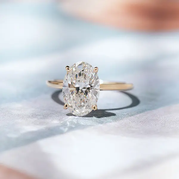 Oval Solitaire Engagement Ring With 1.5mm Band