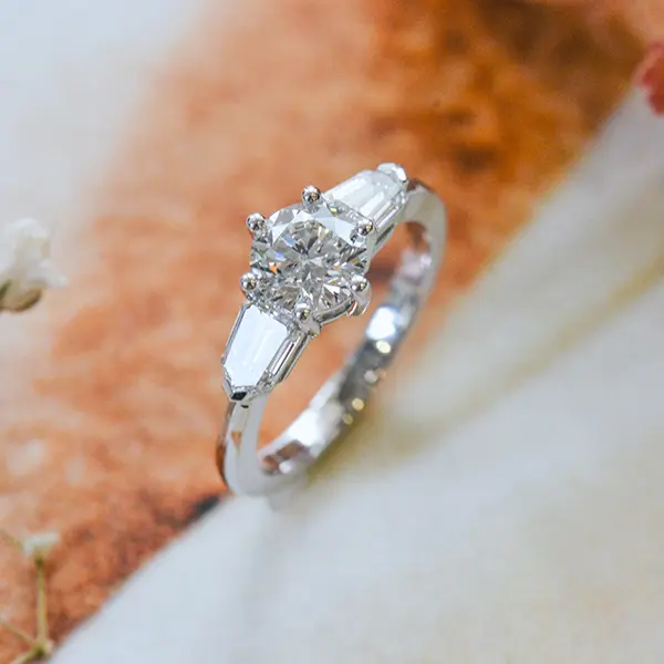Round 3-Stone Engagement Ring With Tapered Step-Cut Bullet Side Stones