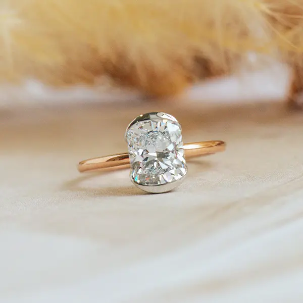 Cushion Two-Tone Engagement Ring With Half Bezel Setting