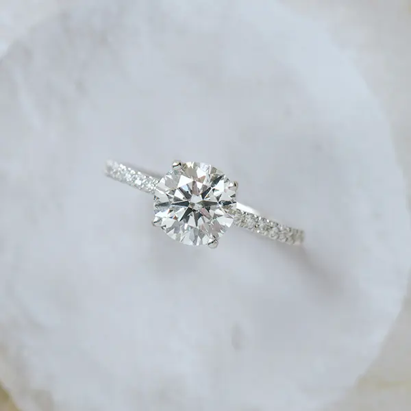Round Pavé Engagement Ring With Whale Tail