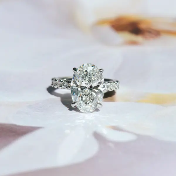 French Pavé Oval Engagement With Hidden Halo Between Claws
