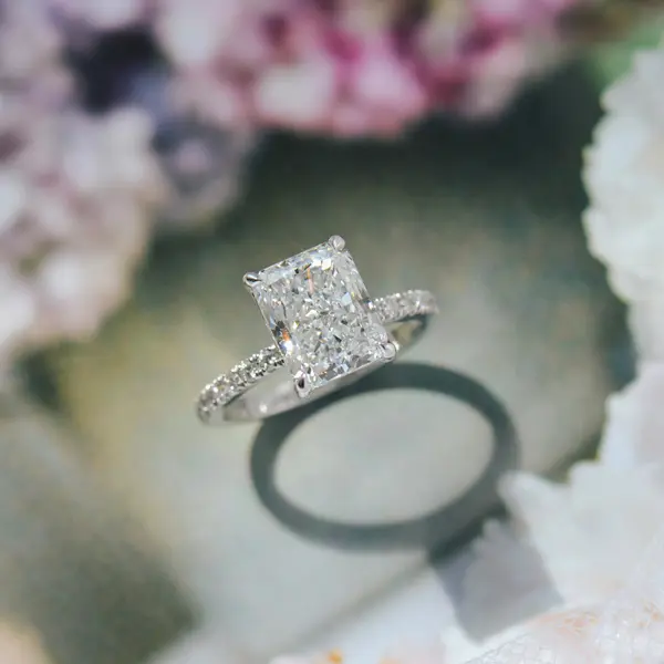 Radiant Engagement Ring With Hidden Halo Between The Claws
