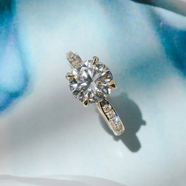 Round Engagement Ring With Pavé and Tapered Band