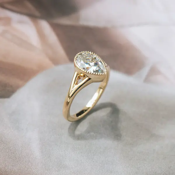 Bezel Set Pear Engagement Ring With Split-Shank-side