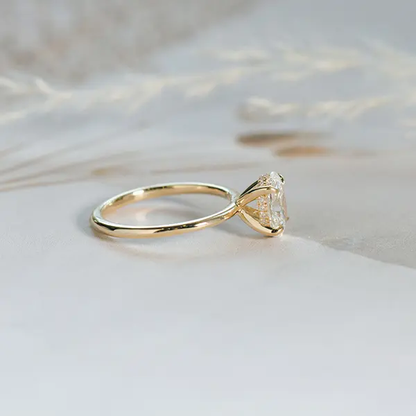Oval Solitaire Engagement Ring With Hidden Halo And Tapered Band-side
