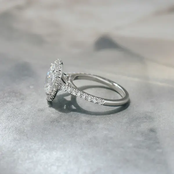 Oval Engagement Ring With Pavé Halo and Cathedral -side