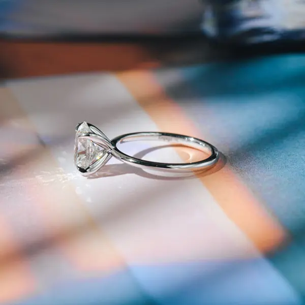 Classic Solitaire Oval Engagement Ring With Fine Short Tip Prongs-side