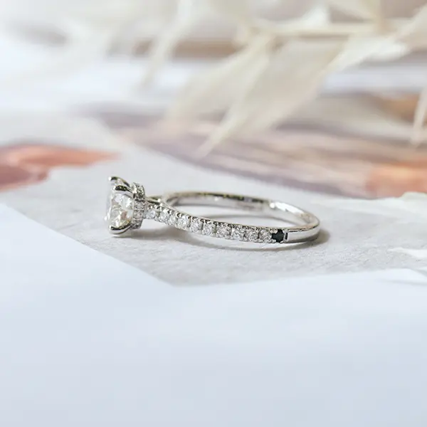 Round Engagement Ring With Hidden Halo Around the Prongs-side