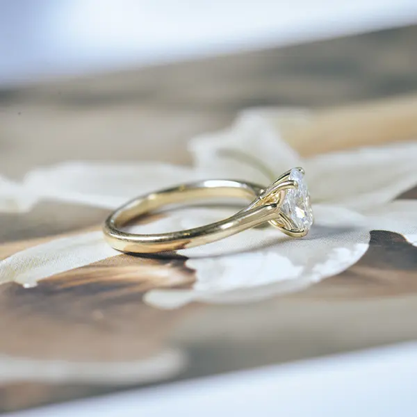 Oval Tapered Engagement Ring With Whale Tail-side