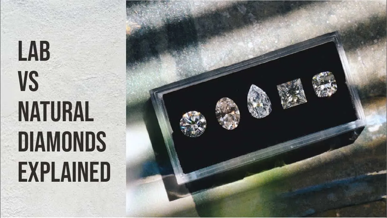 Video poster: Lab vs natural diamonds explained, five loose diamonds of different shapes in a black gem box