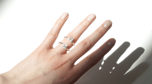 trying on pear moissanite stone and pear lab grown diamond