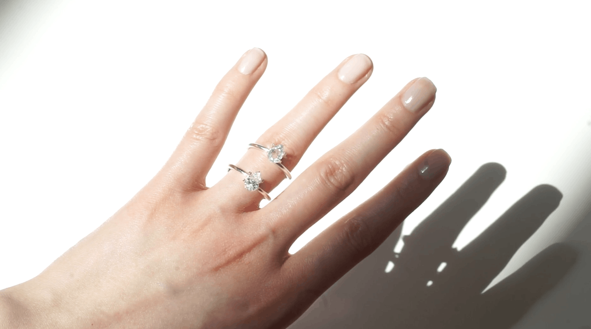 trying on pear moissanite stone and pear lab grown diamond