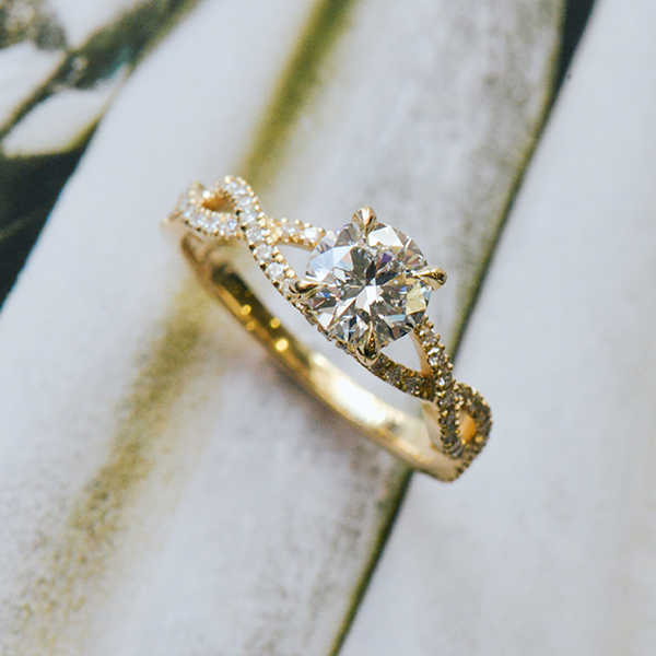 Round 4-Prong Engagement Ring With Pavé Twist Band-side