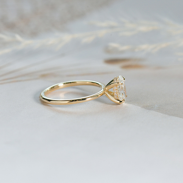 Oval Solitaire Engagement Ring With Hidden Halo And Tapered Band-side