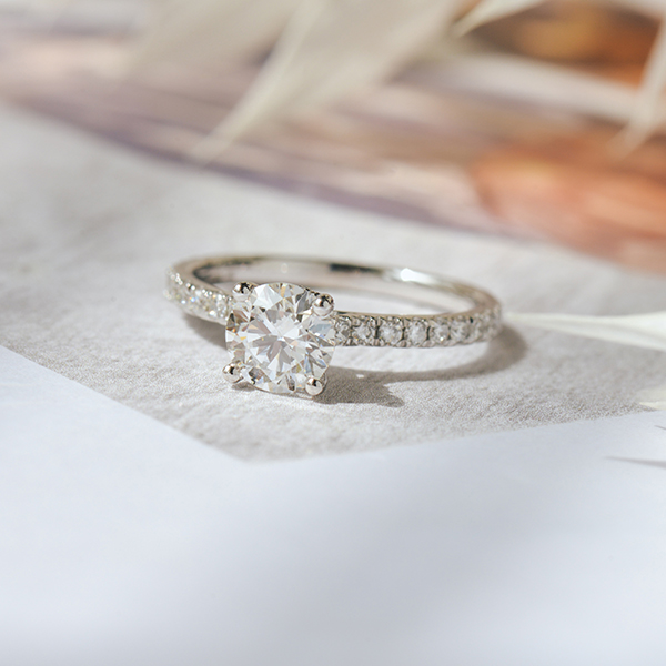 Round Engagement Ring With Hidden Halo Around the Prongs-top