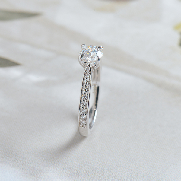 Round Engagement Ring With Channel Set Tapered Band-side