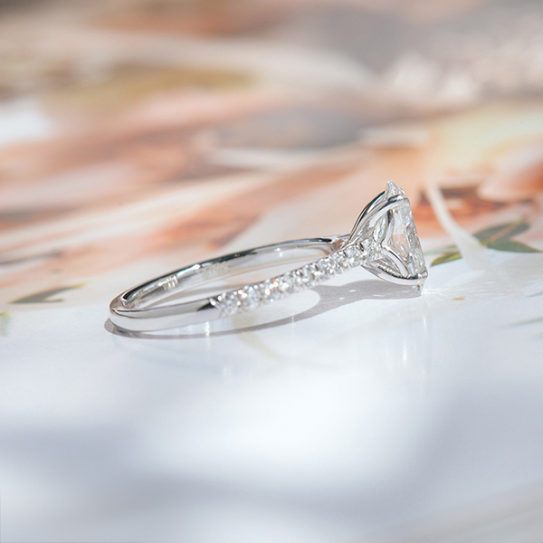 Oval Pavé Solitaire Engagement Ring With Cathedral And Whale Tail-side