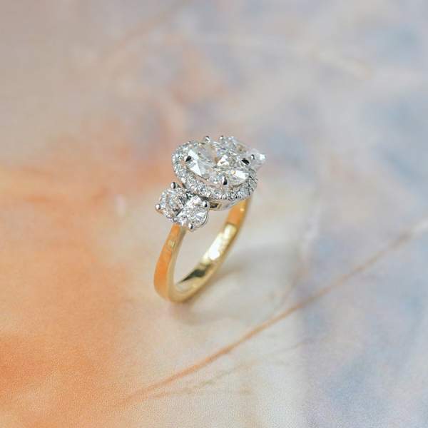 Two-Tone 3-Stone Oval Halo Engagement Ring-side