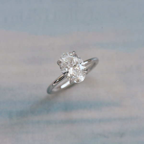 Classic Oval Solitaire Engagement Ring With Hidden Halo-side