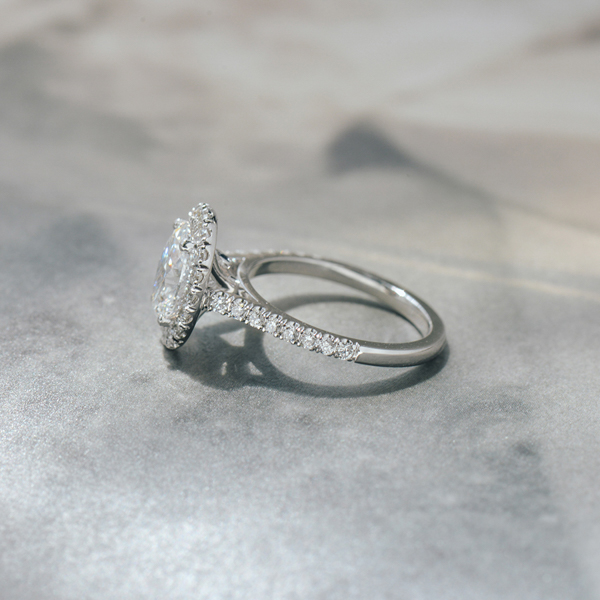 Oval Engagement Ring With Pavé Halo and Cathedral -side