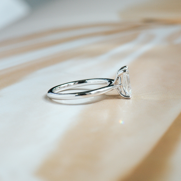 Emerald Solitaire Engagement Ring-side