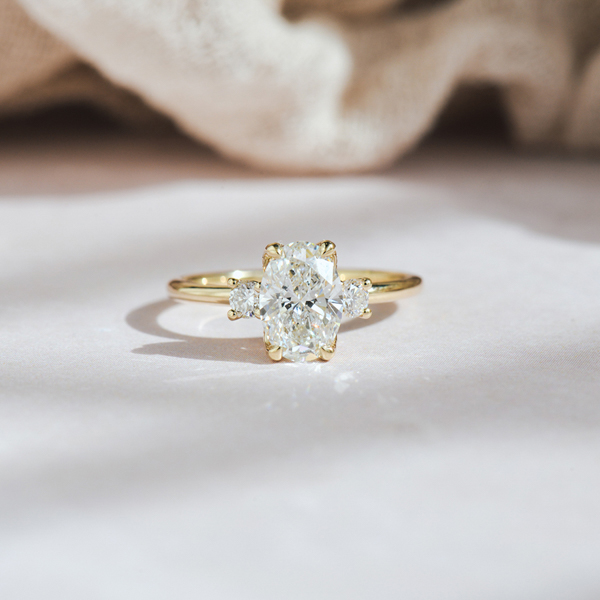 Oval And Round Three Stone Engagement Ring -top