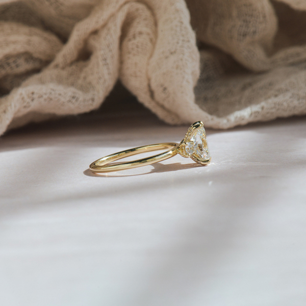 Oval And Round Three Stone Engagement Ring -side