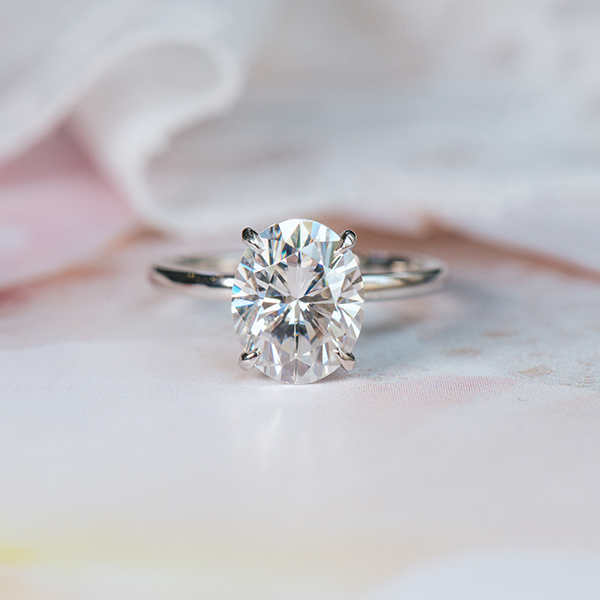 Oval Solitaire With Staggered Hidden Halo Engagement Ring-top